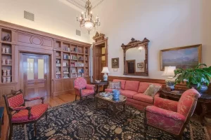 Reception room of the Speaker of the House's apartment inside the Texas Capitol with couch and sitting chairs.