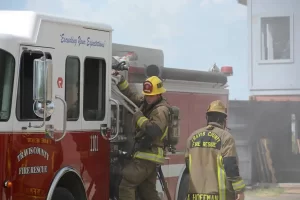 Two crew on a fire truck during training in Travis County, Texas