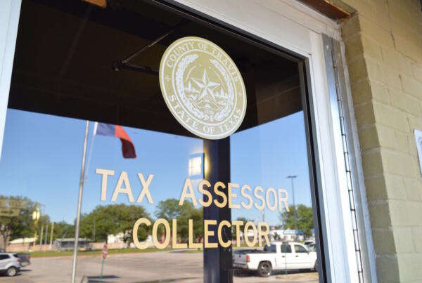 Photo of the door to the Tax Collector-Assessor's Office in Travis County, Texas