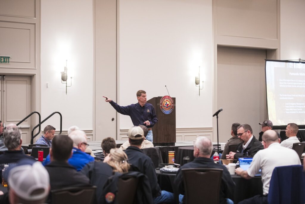 Texas Division of Emergency Management Chief Nim Kidd speaks to firefighters during a workshop about wildfires.