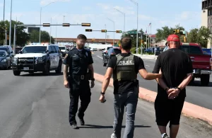 Local law enforcement making an arrest for suspected auto theft in Lubbock, Texas, July 2024.